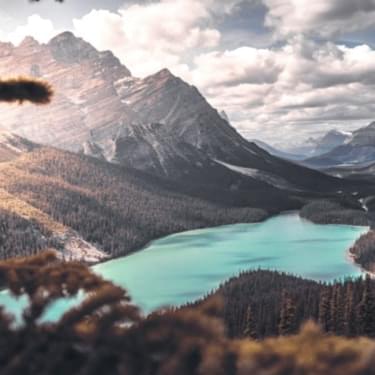 View of lake, forest and mountains.